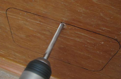 Drilling a hole large enough to allow a saber saw blade access
