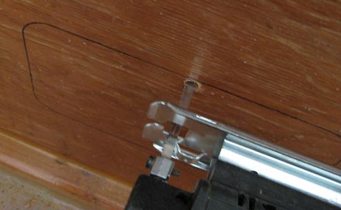 Beginning to cut out the access holes with a saber saw