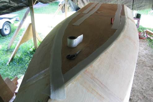 Laying out the fiberglass for the other seams