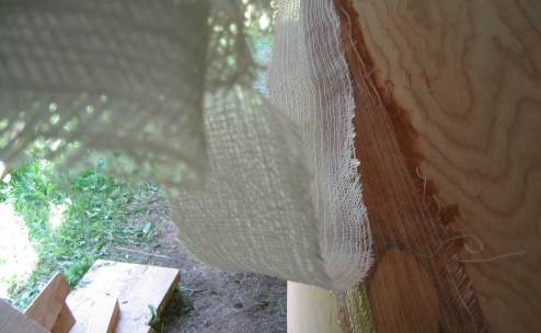 Laying down a second length of fiberglass on a seam