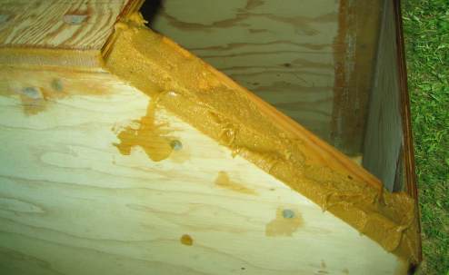 Applying epoxy putty to bilge frame