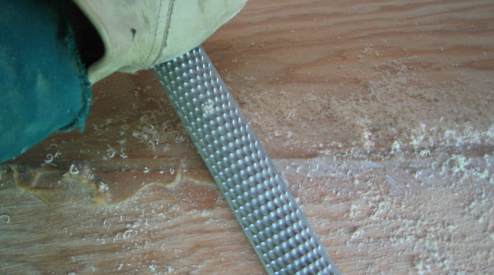 Rounding over filled seam using a rasp