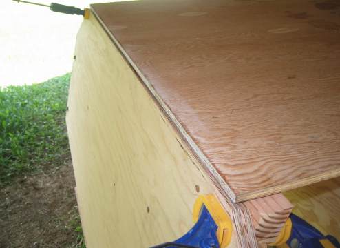 Setting bottom transom frame against bottom
