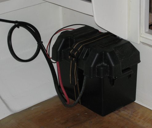 A battery box with the battery inside is installed on the port side next to the cabin bulkhead