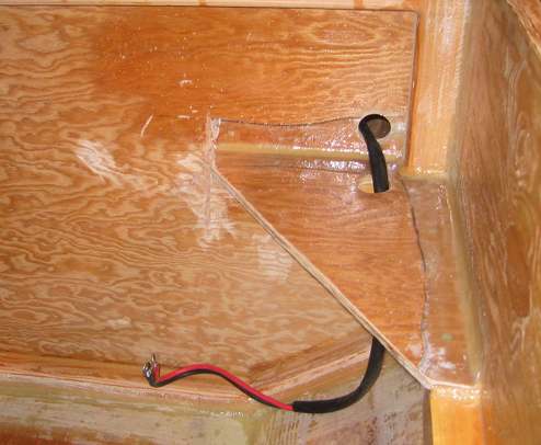 The original battery cables that came installed on the outboard are passed forward through bulkhead 17