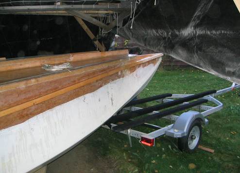 Just before eight neighbors came over and picked up the boat and placed it on the trailer