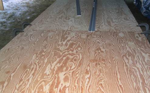Drawing centerline down both panels of plywood