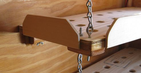 View of how bottom shelf is supported to the top shelf