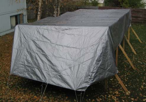 Tarp held up to the rain