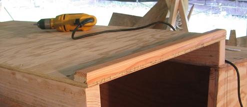 A grab rail of sorts is fastened to the cabin top at the companionway entrance