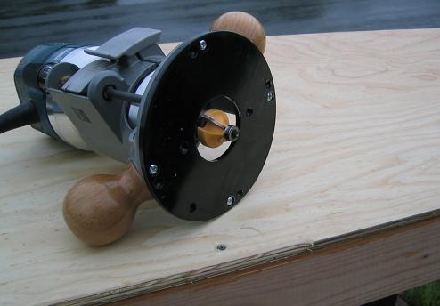 Using a router and a round-over bit, I removed the sharp edges from the underside of the cabin top panel assembly