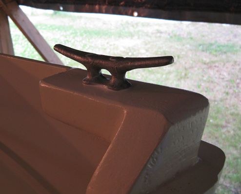 A strip of fiberglass tape was added around the transom frame to the side of the boat