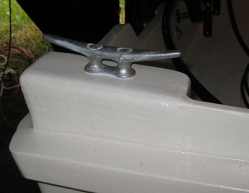 This is a 5-inch galvanized cleat with galvanized bolts clamping it to the mounting block