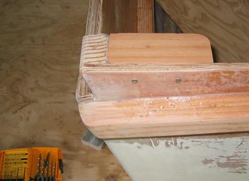 A block of wood was cut to fit and attached with two stainless screws