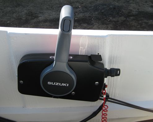 The throttle housing is attached to the inside of the boat using stainless bolts