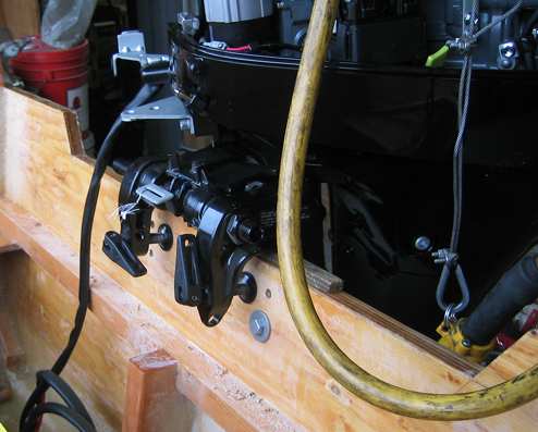 The Suzuki dealership set the proper position and angle for the motor before drilling new 
mounting holes