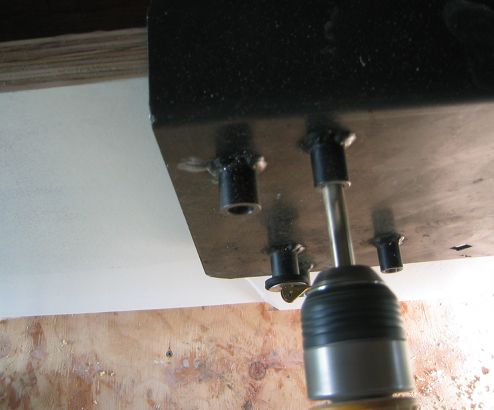 Drilling the mounting holes using the guides on the template