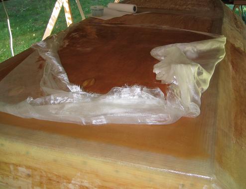 Something went terribly wrong with my epoxy mix; I ripped all of the partially 
saturated cloth from the boat