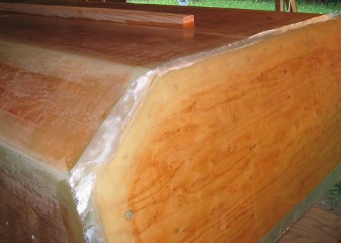 You pull in the direction where you need the epoxy to go, but also in a direction that keeps the 
cloth strait