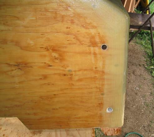 The last step for this transom was to bore through the fiberglass cloth that covered over the holes for the transom bolts