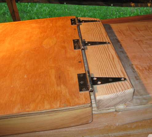 The hatch is attached to the pivot block with three Stanley Hardware stainless steel hinges