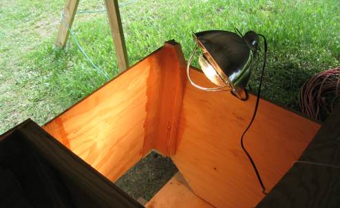 Pointing a heat lamp at the transom frame and Bulkhead 11