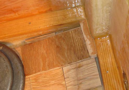 This deck frame bridge was just epoxy-glued, and 
is being held in place by another piece of wood with weights on top