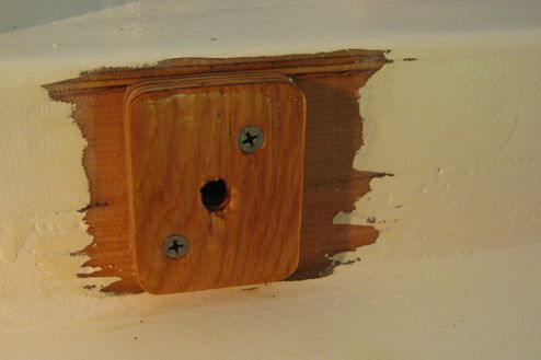 The extender block is sealed with epoxy and then painted white to match 
the rest of the boat