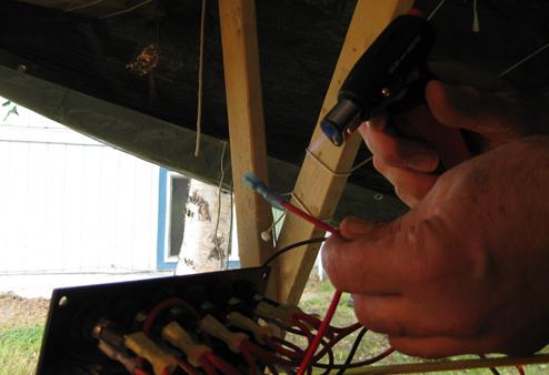 Attaching an Ancor Marine heat-shrink disconnect to the positive wire going to the position light switch