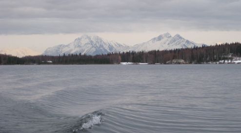 Moving away from the dock, mountains in background