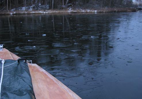 Thin sheet of ice frozen on top of Mirror Lake, AK