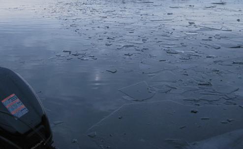 Broken surface ice from turning around boat
