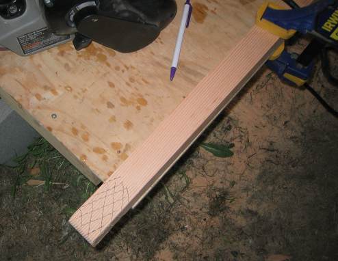 Sanding the end of the stiffener with a belt sander to adjust for fit