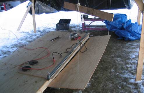 Supporting cut off piece of ply with rope