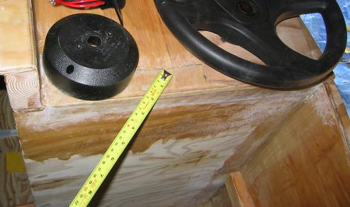 Looking down at the naked bulkhead planning where to place the dash and steering gear