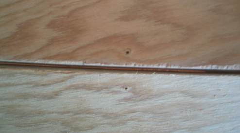 Drill a hole in each plywood panel to be joined