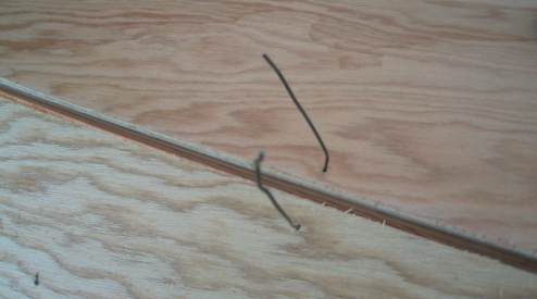 Feed cut wire from opposite side through holes
