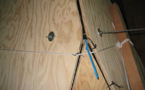 I then came up with the idea of using 1/4-inch threaded rod through both bilge panels with washers 
	and nuts to bring the panels to their final position