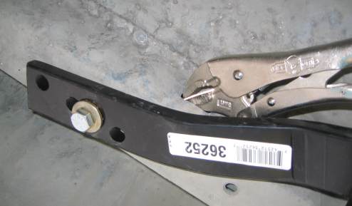 Handle on nut being clamped with a vise grip