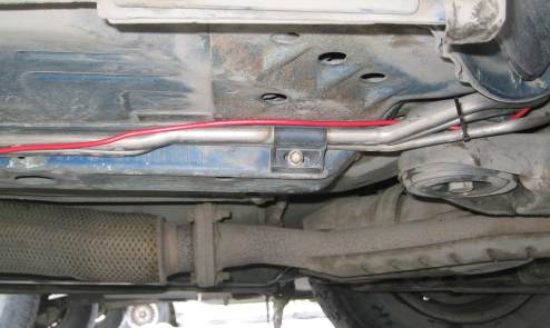 Leading the power wire up into the engine compartment