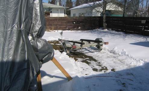 The trailer is parked in my back yard