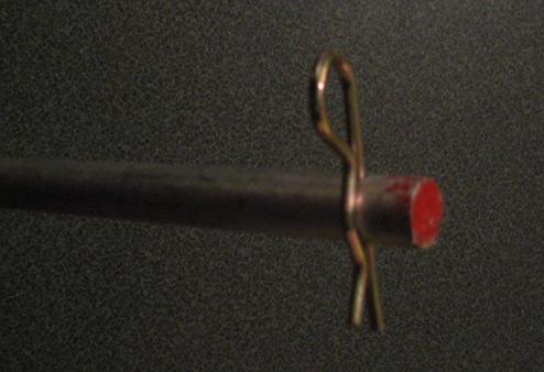 Steel rod down to 27-inches in length, and then drilled a hole at each end to accept a cotter pin